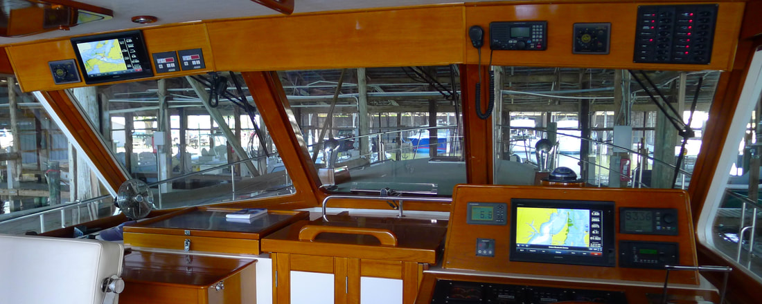 Dual display Garmin navigation system installation by Snead Island Boat Works